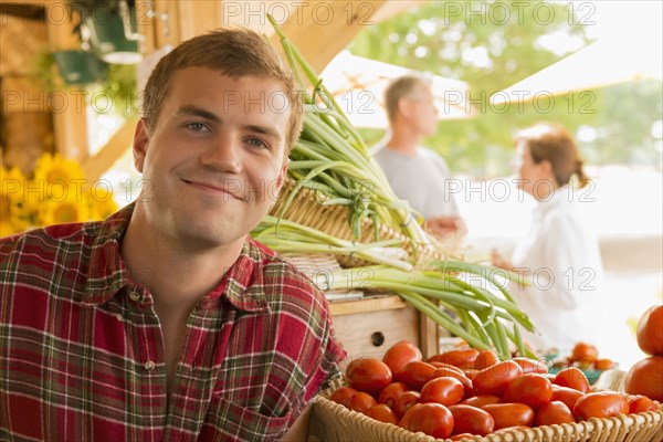 Caucasian man with produce at farmers market