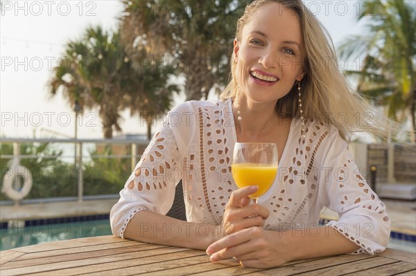 Caucasian woman drinking orange juice