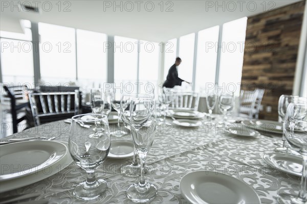 Table setting in empty restaurant