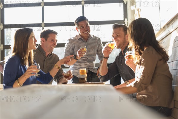 Friends drinking beer in brew pub