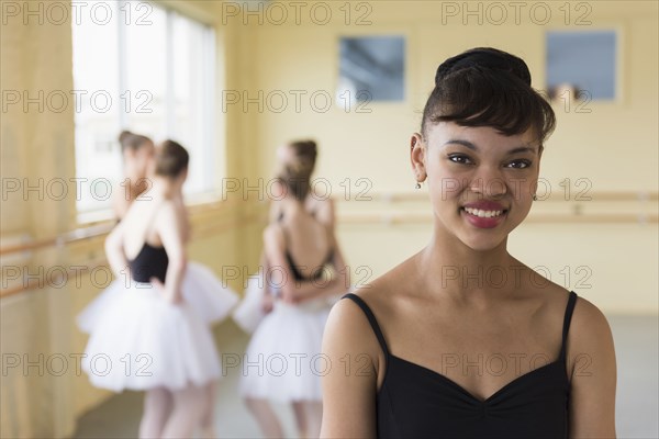 Portrait of girl smiling in ballet studio