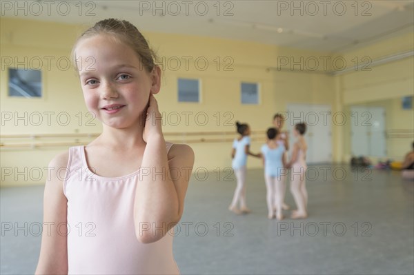 Portrait of smiling girl in ballet studio