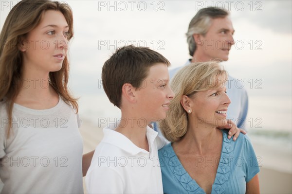 Caucasian family enjoying beach