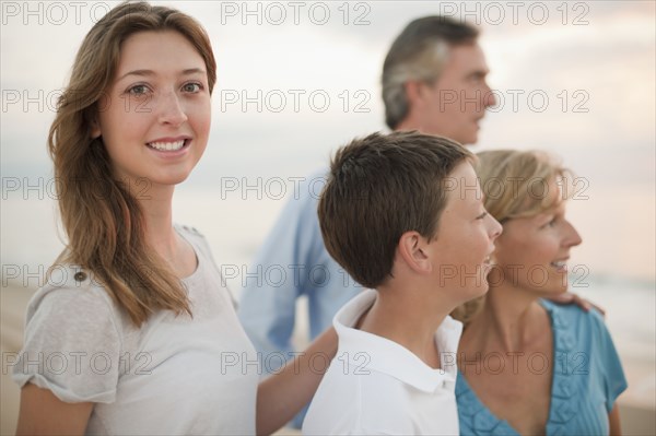 Caucasian family enjoying beach