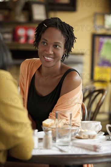 African American friends having lunch in restaurant