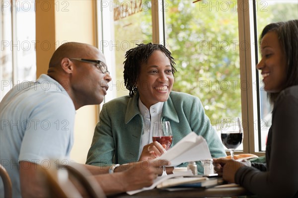 African American co-workers working in restaurant