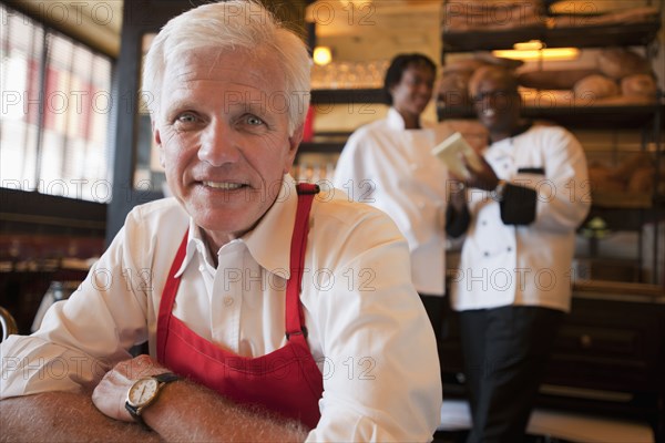 Caucasian waiter sitting in restaurant