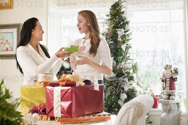 Friends exchanging Christmas gifts