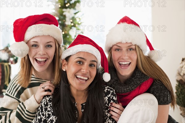 Friends wearing Santa hats