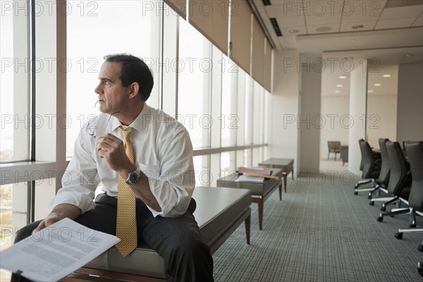 Caucasian businessman working in conference room