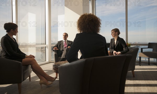 Business people having informal meeting