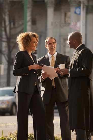 Business people talking together outdoors