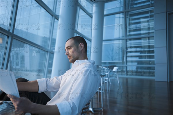 Caucasian businessman looking at paperwork