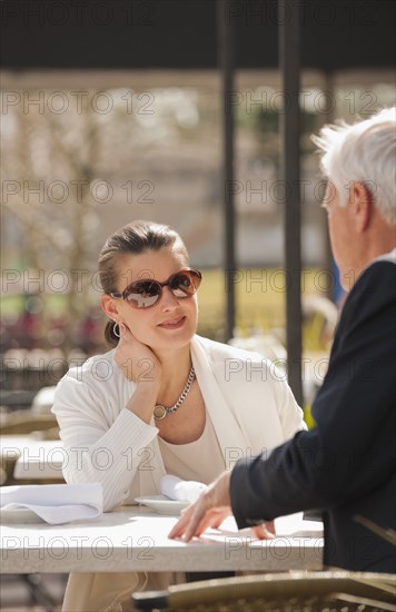 Caucasian business people talking in cafe