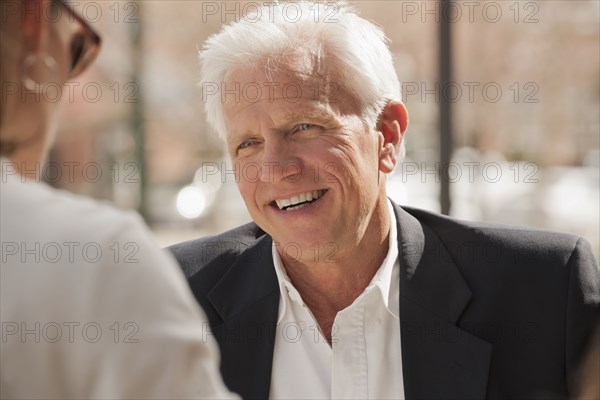 Caucasian couple talking outdoors