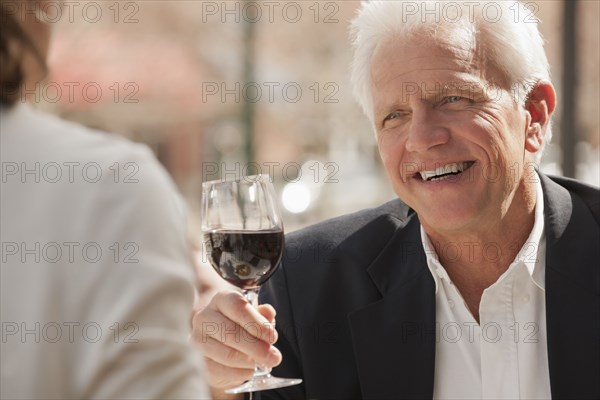 Caucasian couple drinking wine