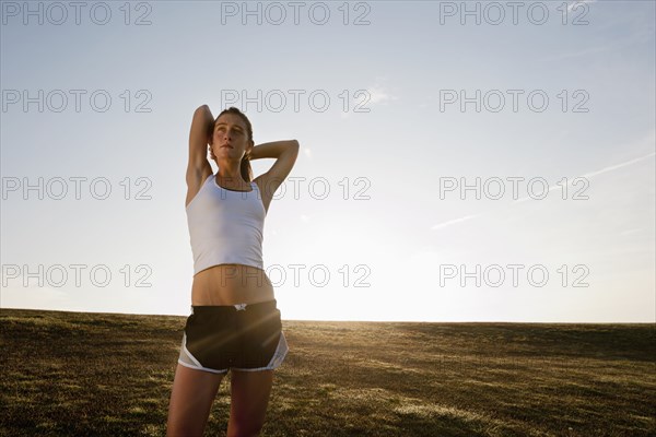 Caucasian runner stretching before exercise