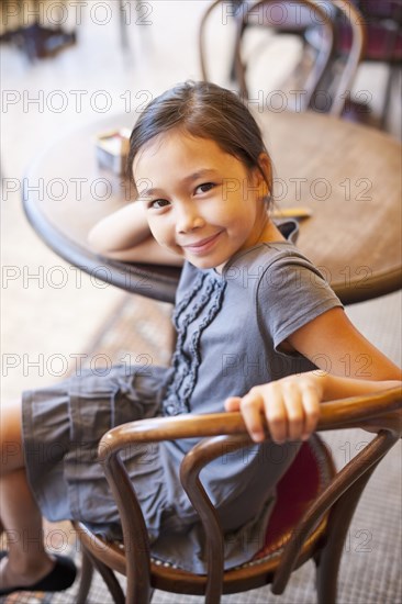 Asian girl sitting in cafe