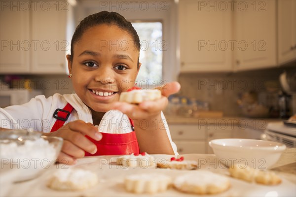 African American girl baking in kitchen