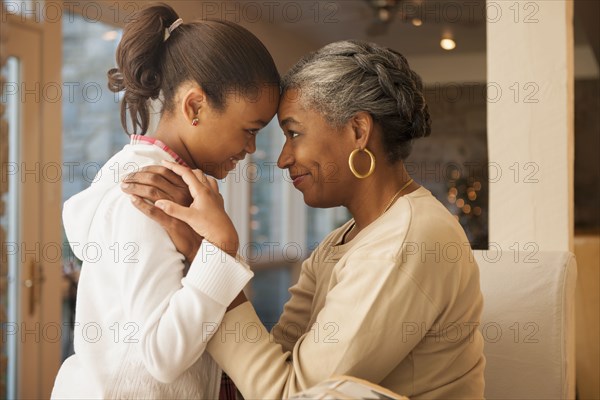 African American woman and granddaughter smiling