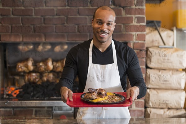 Black server working in restaurant