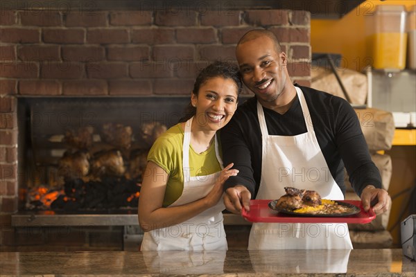 Couple working together in restaurant