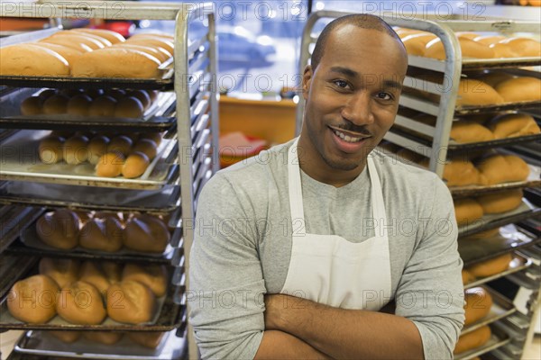 Black baker working in commercial kitchen