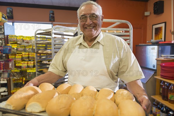 Hispanic baker working in commercial kitchen