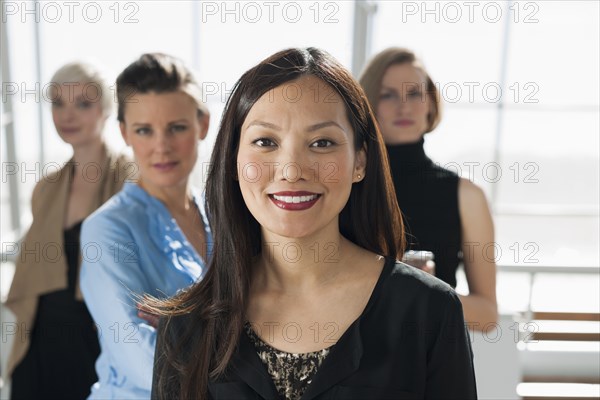 Businesswomen smiling in office