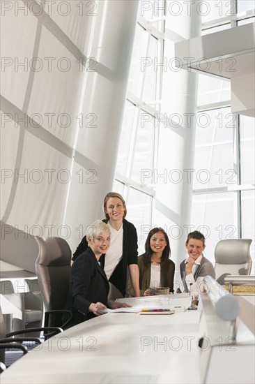 Businesswomen smiling in meeting