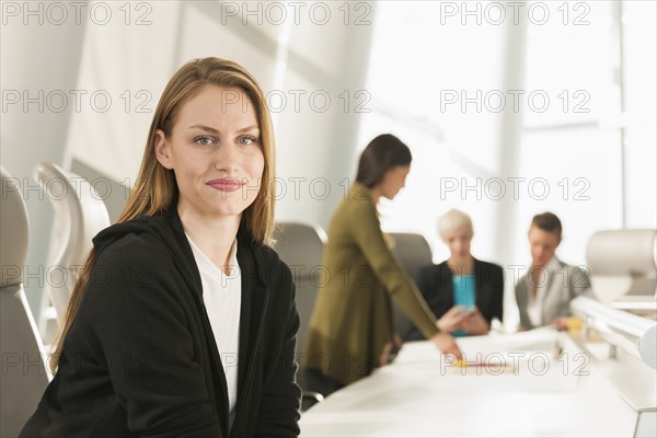 Businesswoman smiling in meeting