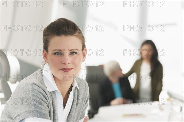 Businesswoman smiling in meeting