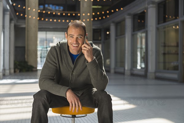 Caucasian man talking on cell phone