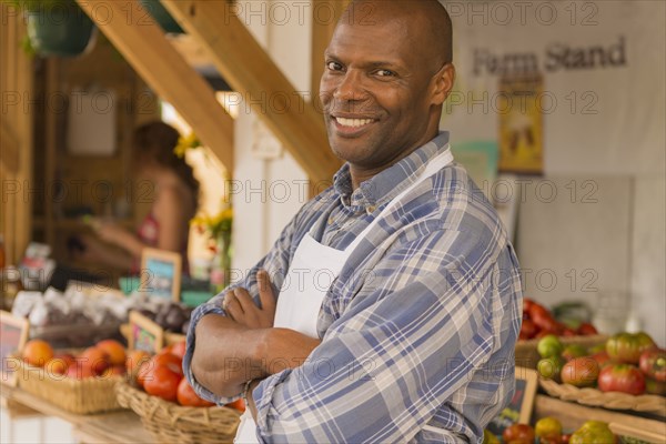 African American vendor smiling at farmers market