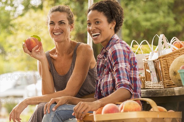 Women laughing at farmers market