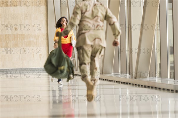 African American soldier greeting wife in airport