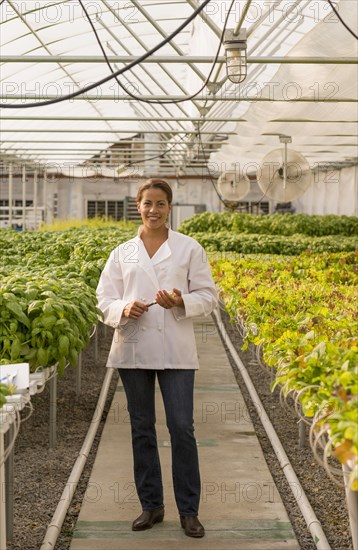 Black chef standing in greenhouse