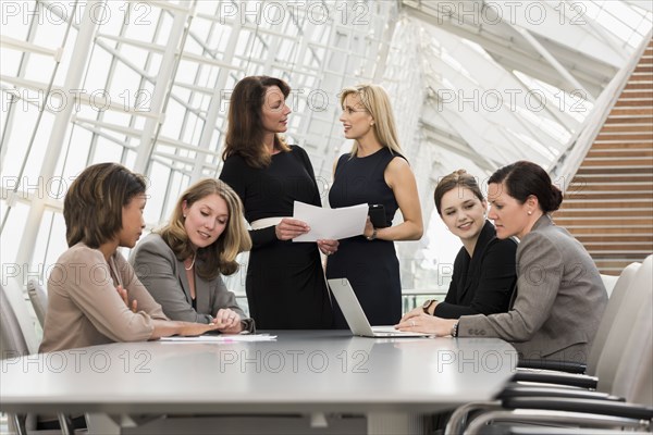 Busy businesswomen meeting in conference room