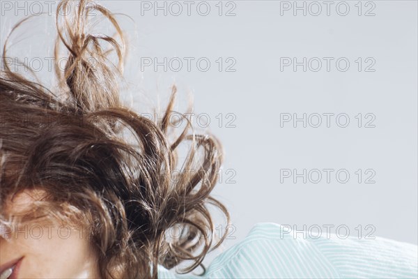 Caucasian woman tossing her hair