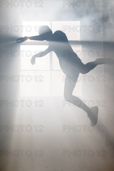 Shadow of Caucasian man at window