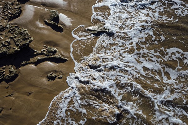 High angle view of waves on beach