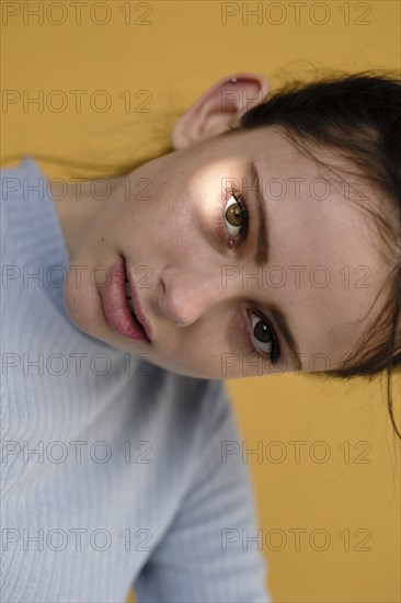 Close up of Caucasian woman tilting head