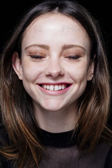 Smiling Caucasian woman with eyes closed