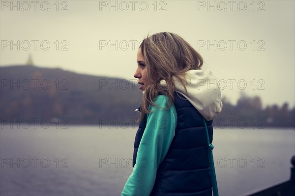 Caucasian woman admiring scenic lake view