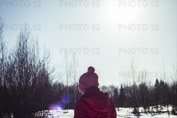 Caucasian girl in snowy field