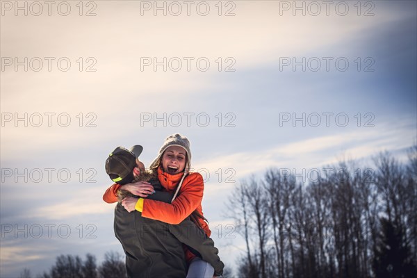 Caucasian couple hugging outdoors