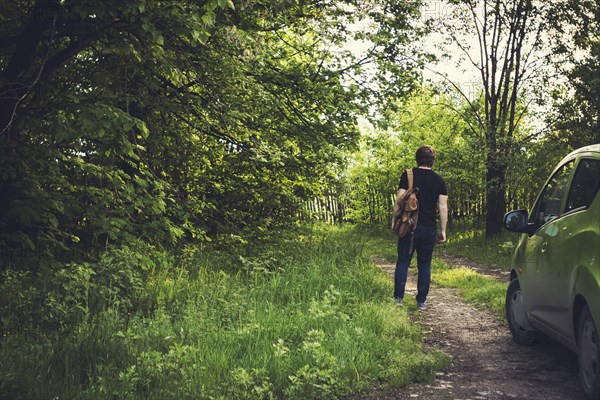 Caucasian woman walking on dirt path