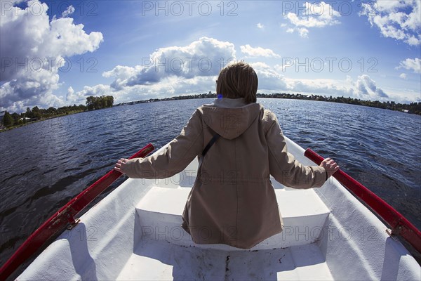 Caucasian woman rowing boat