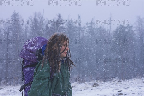 Caucasian hiker walking in snow