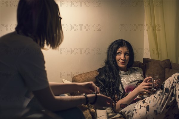 Caucasian women talking in living room